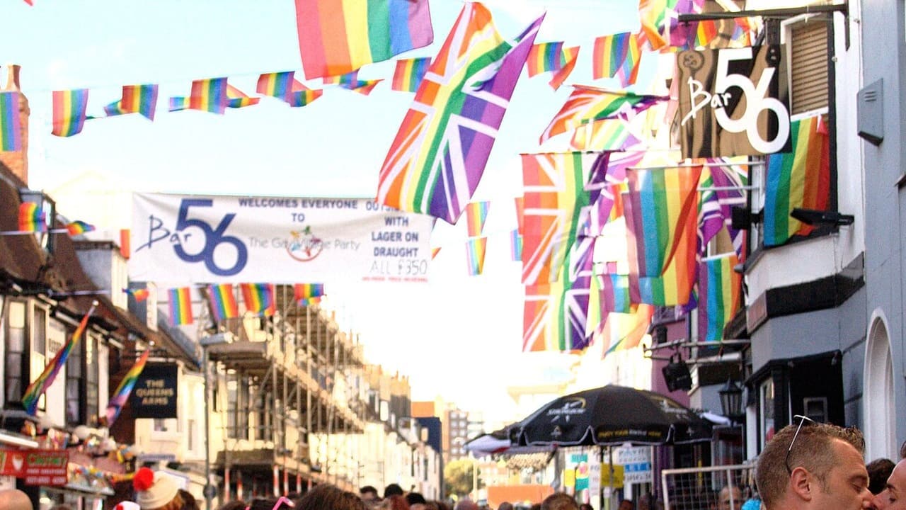 Rainbow flags and bunting hang over a busy St James's Street in Kemp Town during the Brighton Pride Street Party in 2013
